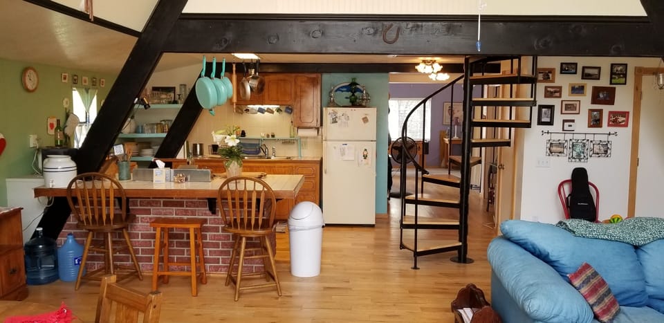 TV room in the back, loft above