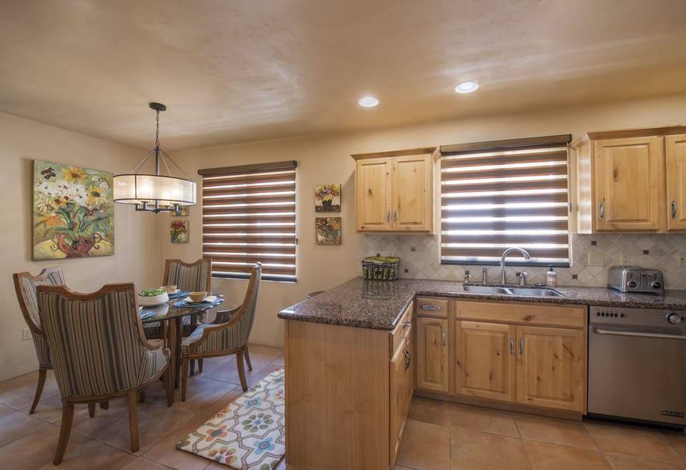 Kitchen with eat in breakfast area bathed in abundant light