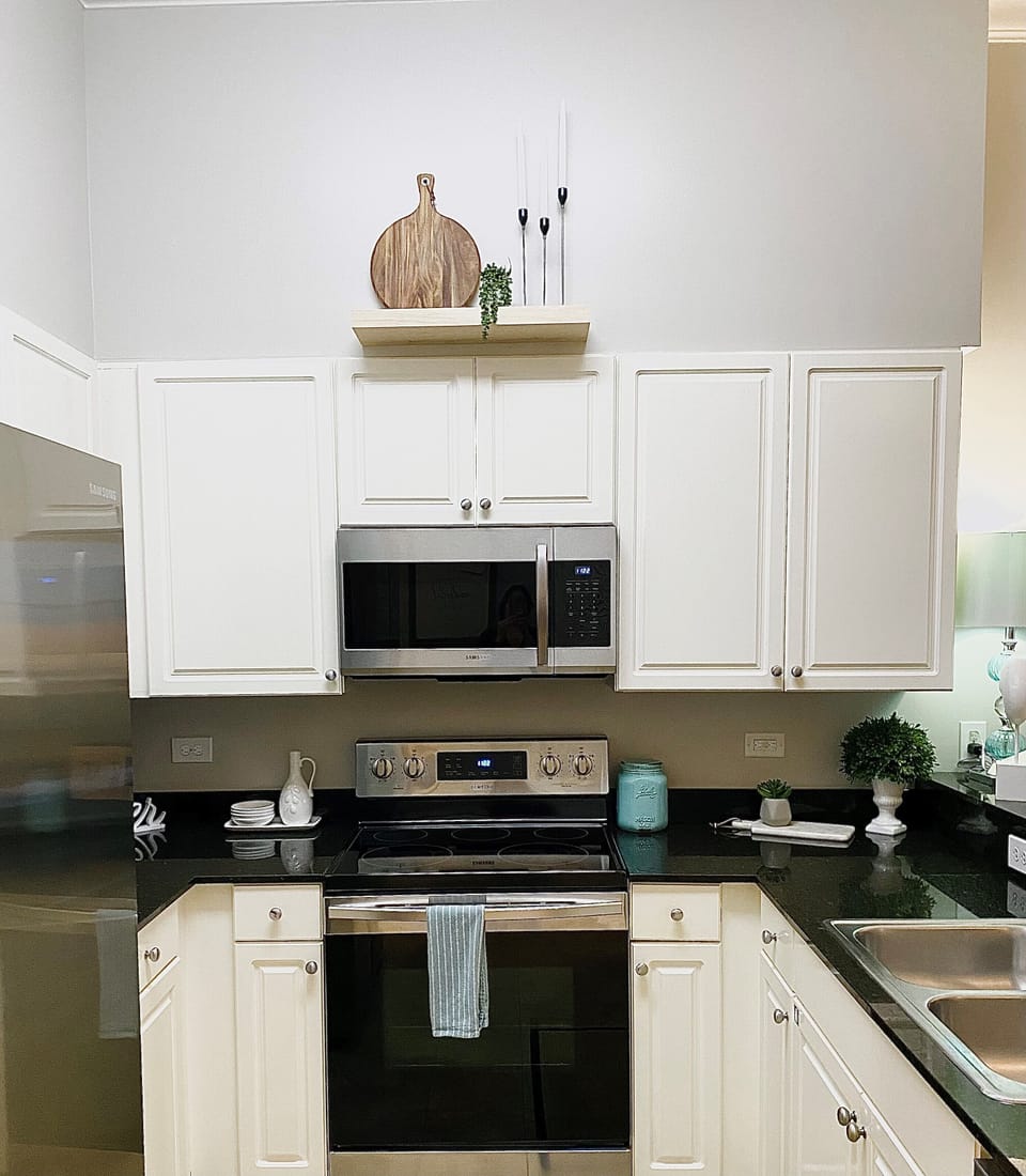 Bright Kitchen with New Stainless Steel Appliances, Painted Walls & Cabinets.