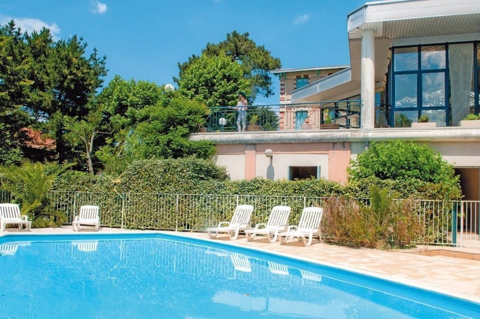 Lounge by the pool in the sunshine.