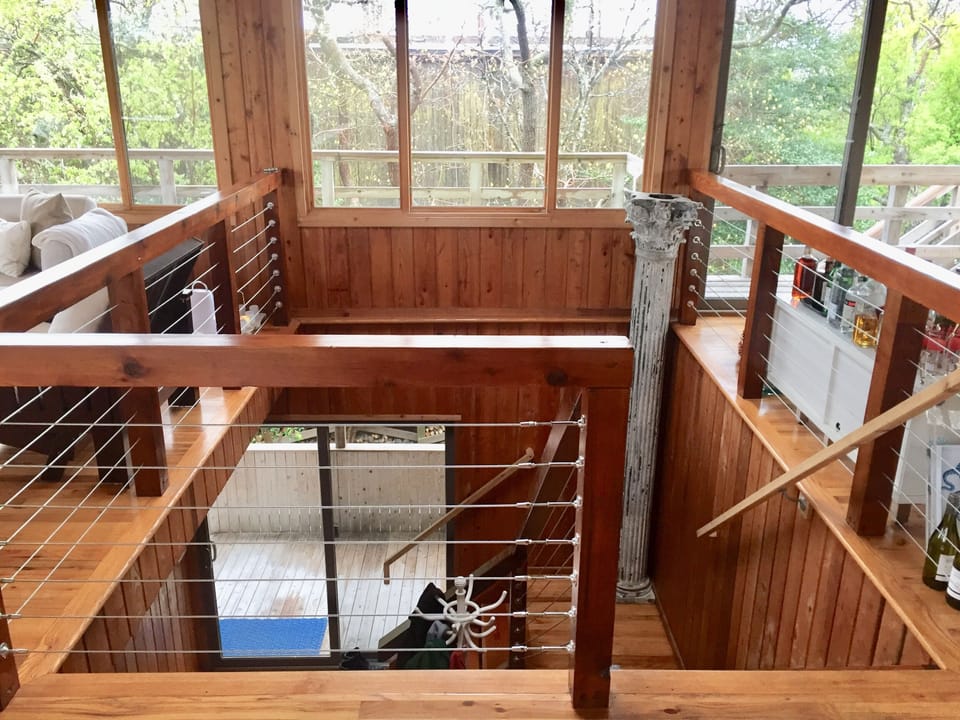 Staircase connecting bedroom level to living and dining rooms