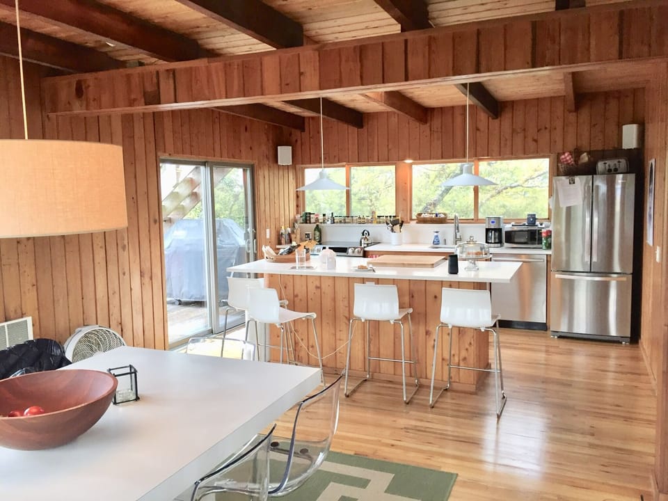 The kitchen is fully equipped with stainless steel appliances.