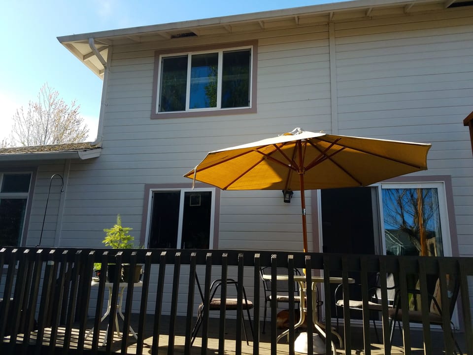 Back deck. Sliding doors open right into kitchen; easy to dine on deck.