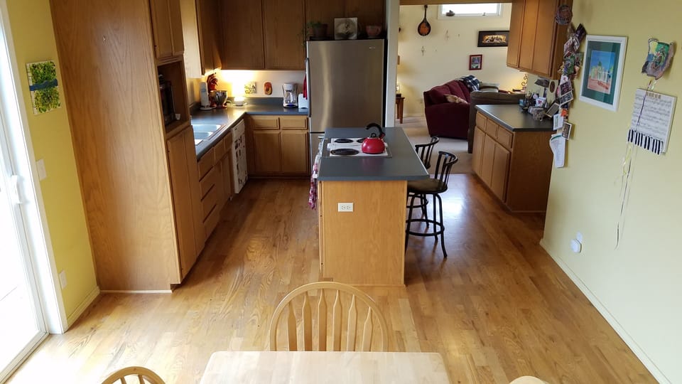Spacious kitchen, fully stocked with dishes and appliances.