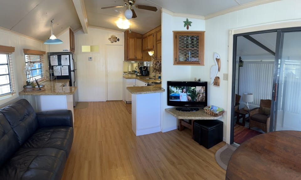 UPSTAIRS TV room with privacy doors, Looking toward the kitchen and bed/bath.