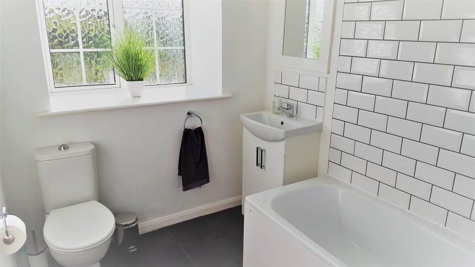 Main bathroom with bath and shower.  There is a separate WC