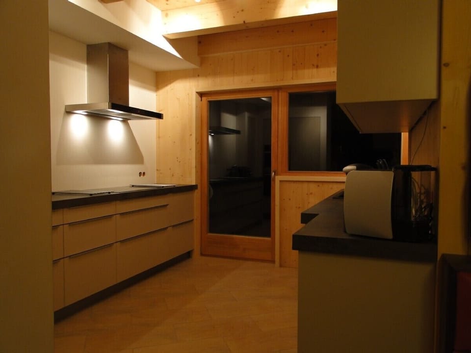kitchen with deck overlooking piste