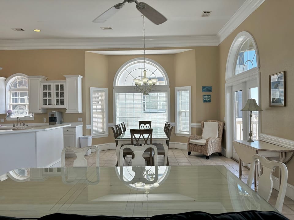 Looking  towards two other dining areas and kitchen