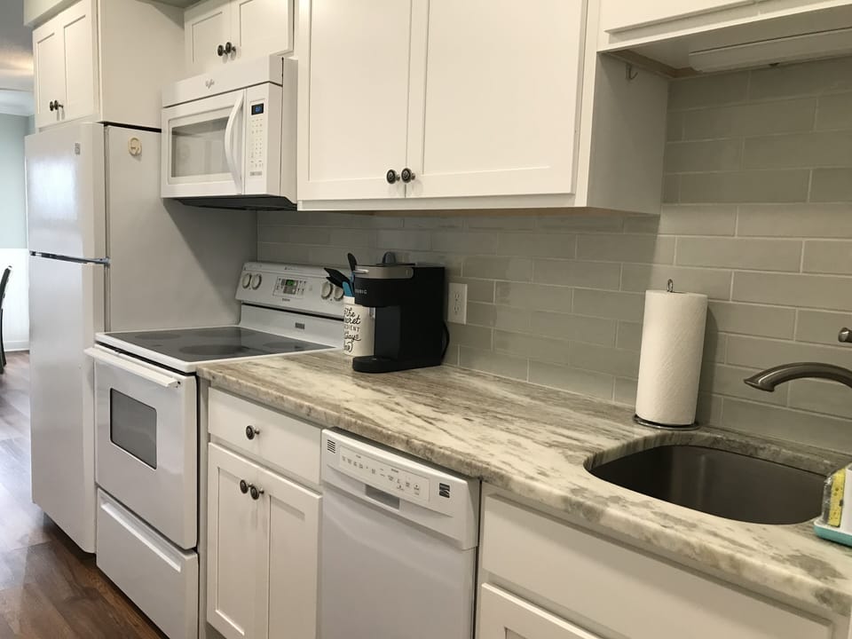 Renovated kitchen with expanded counter and storage space