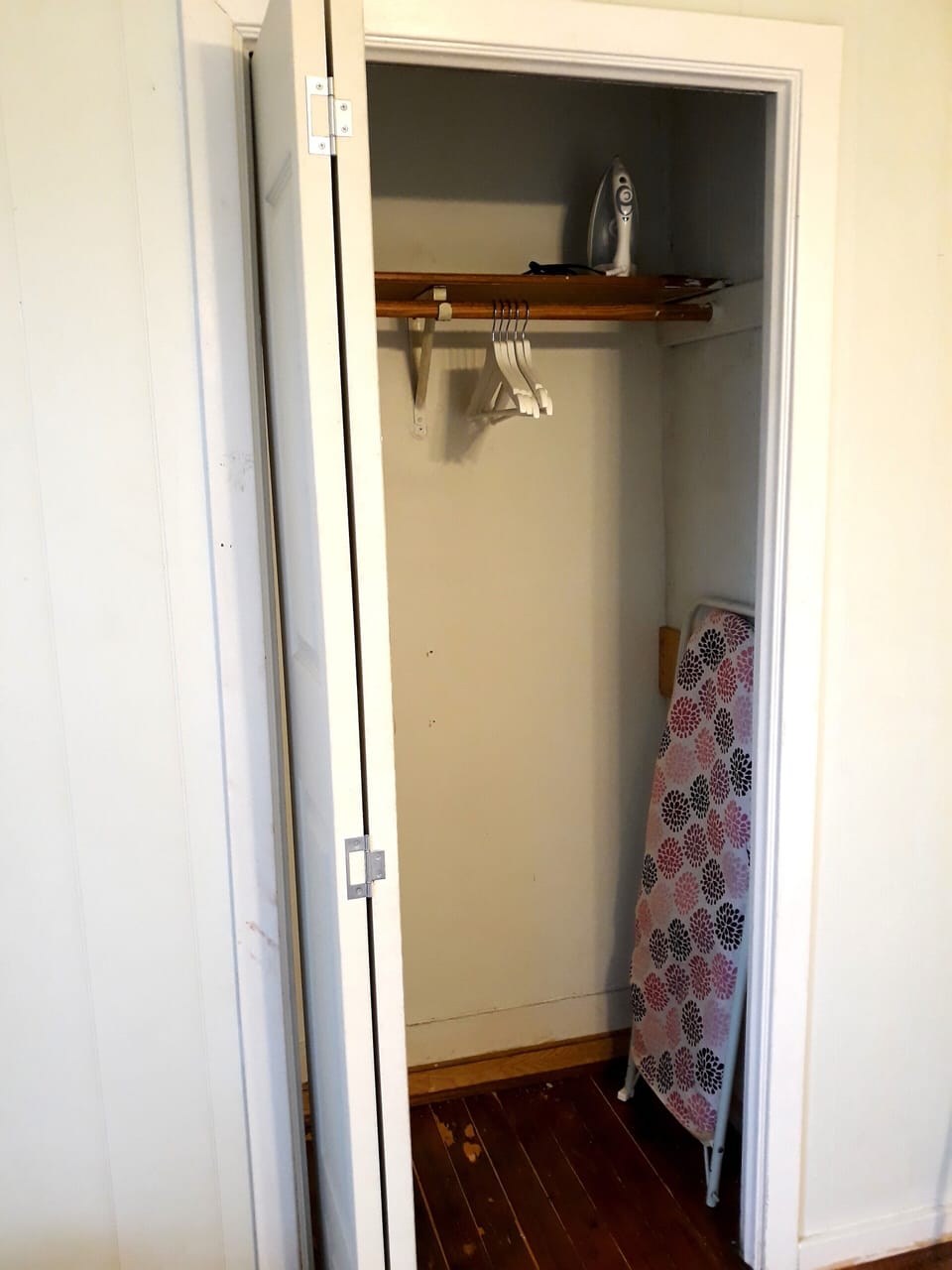 Hangers, iron, and ironing board make it easy look put together