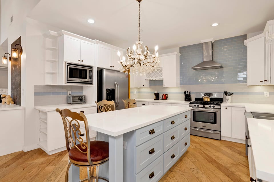 Fully equipped cabin kitchen with ample cabinetry, stove, fridge, microwave, and coffee maker—perfect for cooking meals, morning coffee, and feeling right at home on your stay.