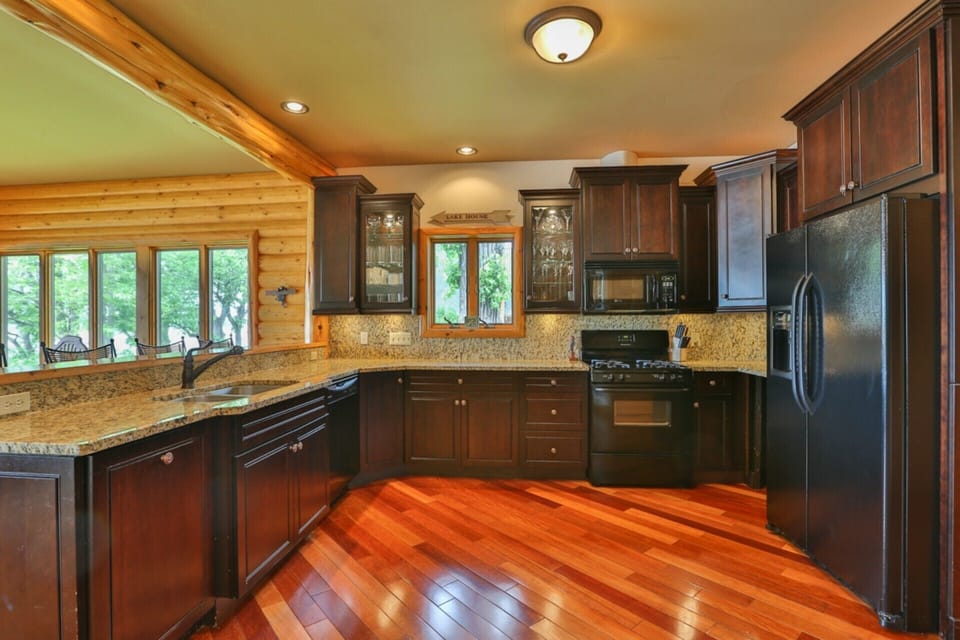 Peppercorn Cherry cabinets. Brazilian Cherry Floors. Granite counters. Lake View