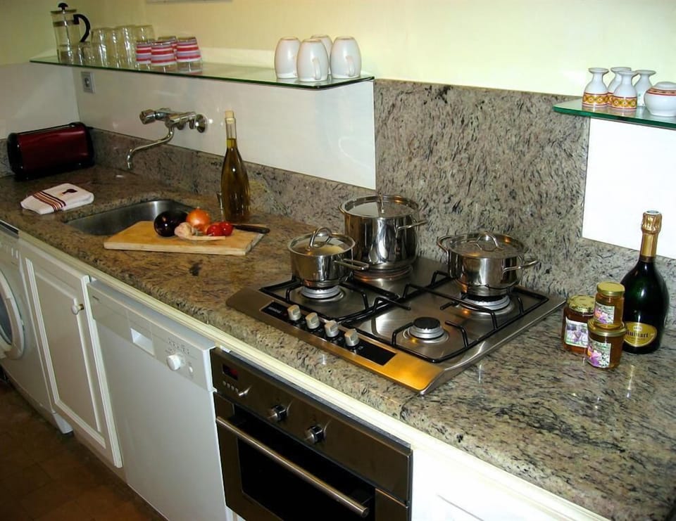 Galley Kitchen: marble, Lagostina utensils, Siemens stainless steel oven.