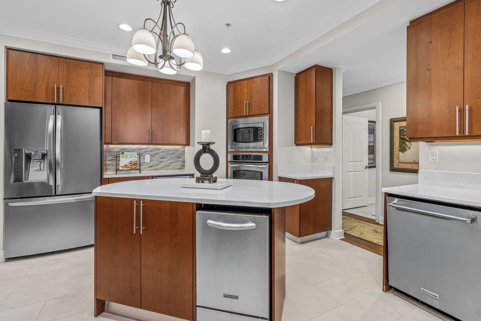Gourmet Kitchen: large refrigerator, dishwasher, microwave, and ice machine.