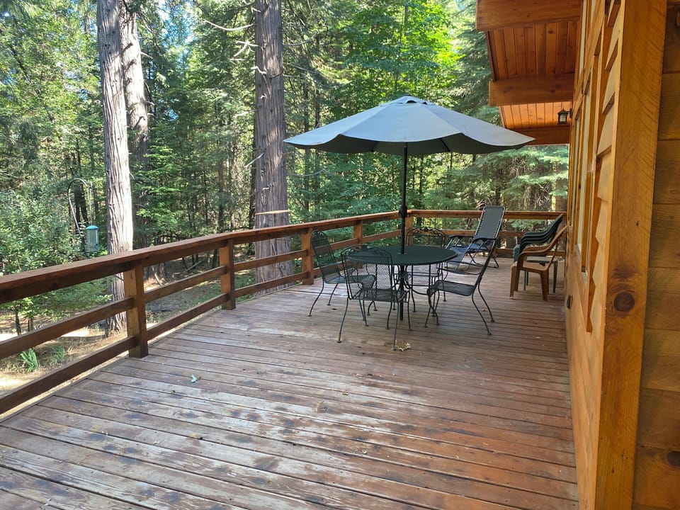 Spacious deck with forest view.  Enjoy your morning coffee or a quiet evening