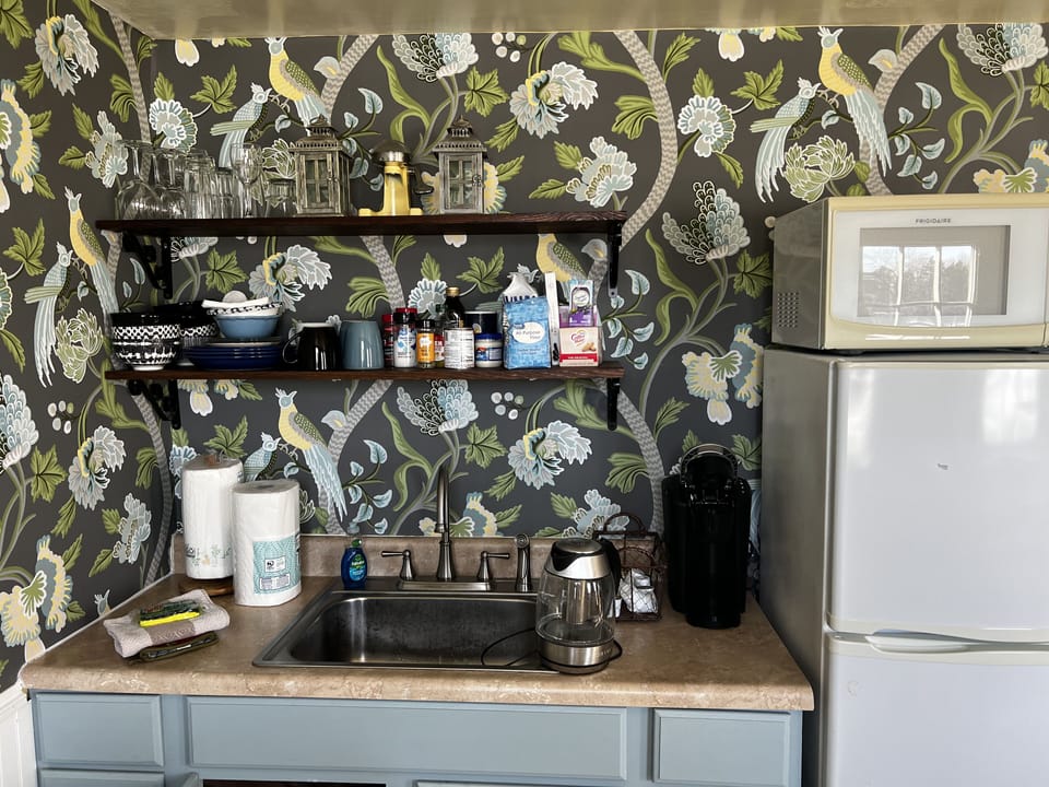 Keurig coffee, hot water kettle, micro and full fridge.