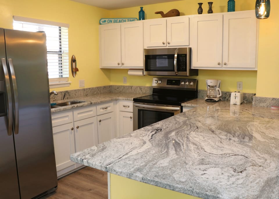 Brand new granite and stainless steel appliances