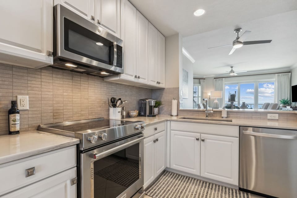 Immaculate Luxury Kitchen Fully Equipped For All Your Cooking Needs-Stainless Steel Appliances, Handsome Granite Countertops, Wine Cooler, and Bar Area