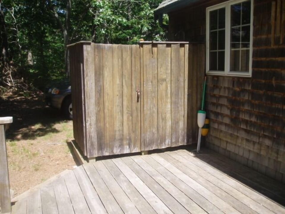 Enclosed outdoor shower with hot water and plenty of privacy
