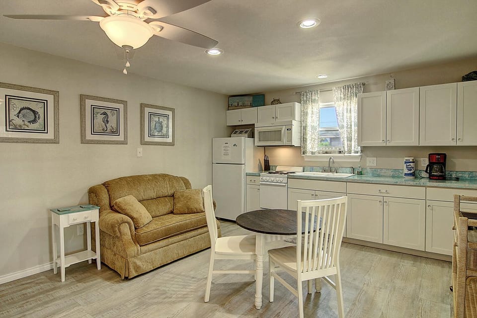 Unwind in your comfortable living space with a fully equipped kitchen, perfect for preparing meals and relaxing after a day of adventure.