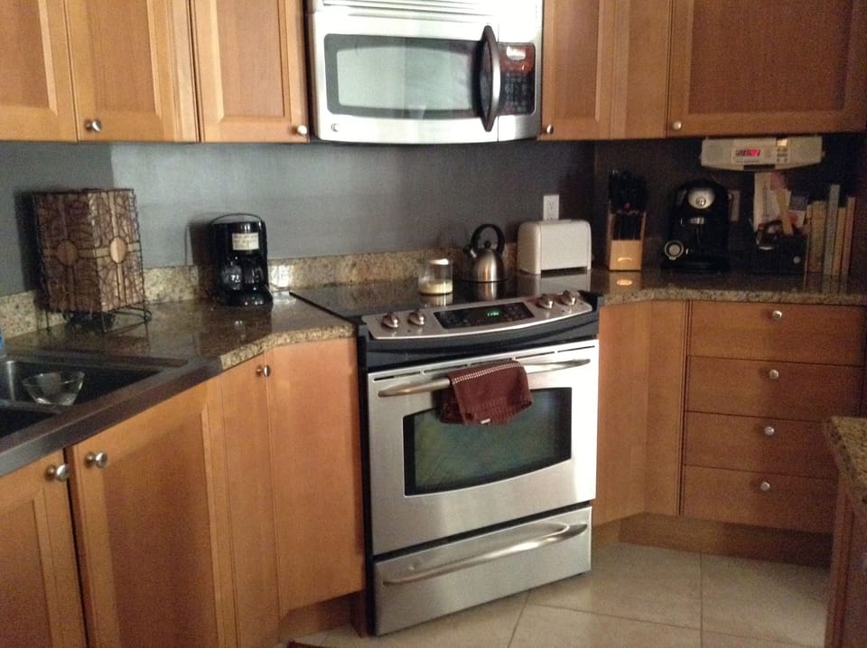 Kitchen, granite countertops, stainless appliances, ceramic tile floor