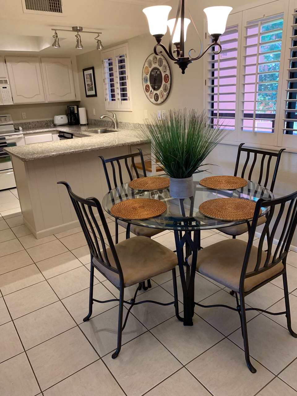 Plantation shutters in kitchen and dining area.