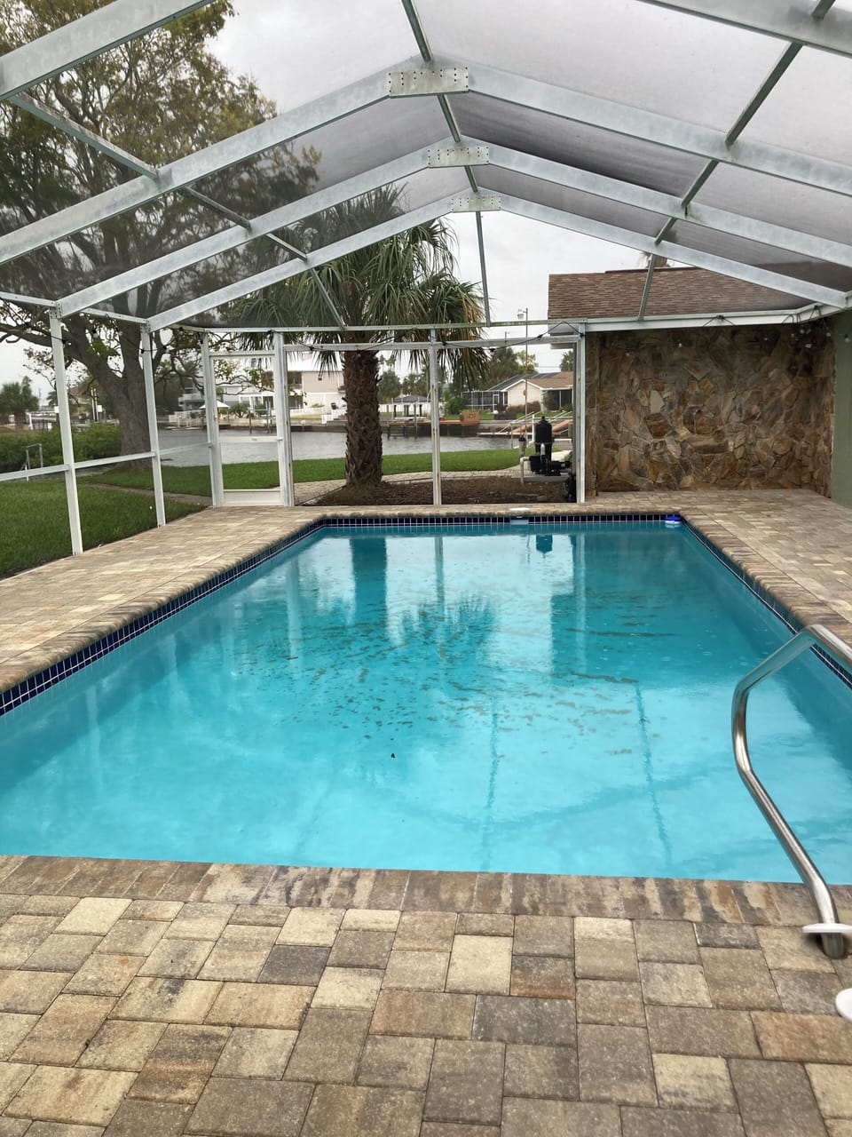 pool with a view inside a screened lanai