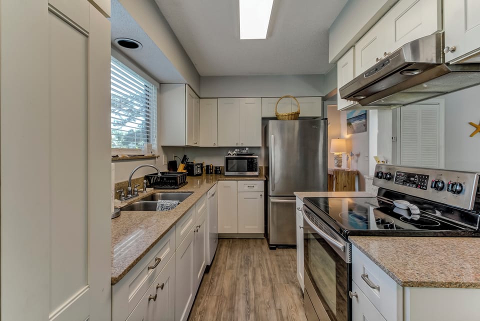 Fully Equipped Kitchen with Beautiful Granite Countertops and Stainless Steel Appliances