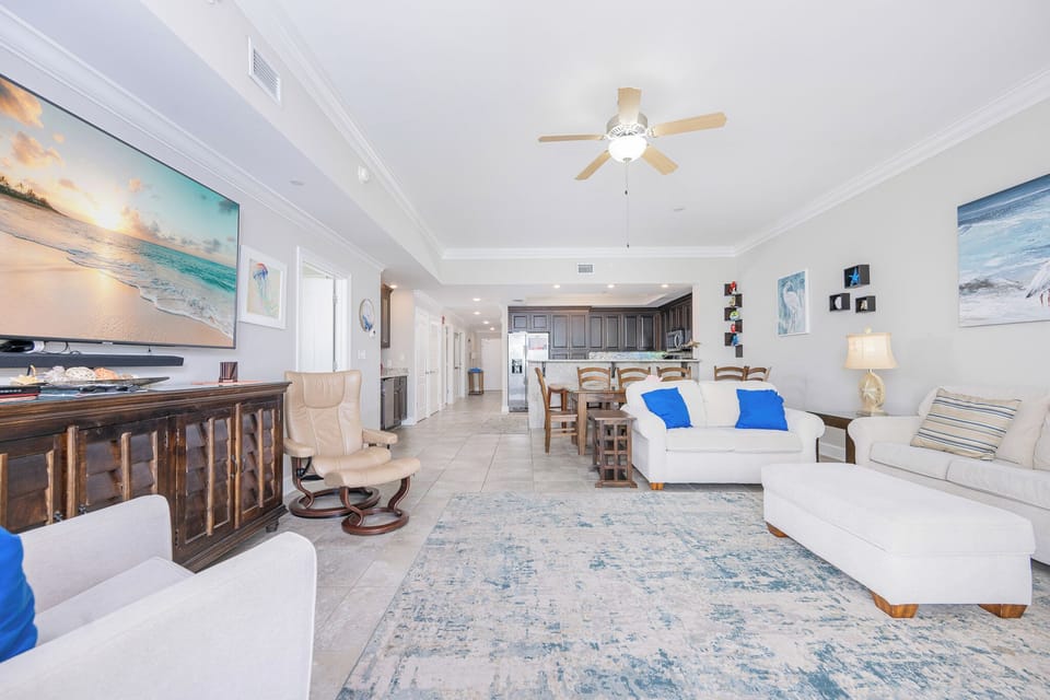 Unwind in the inviting living area, where natural light floods in, creating a warm and welcoming ambiance