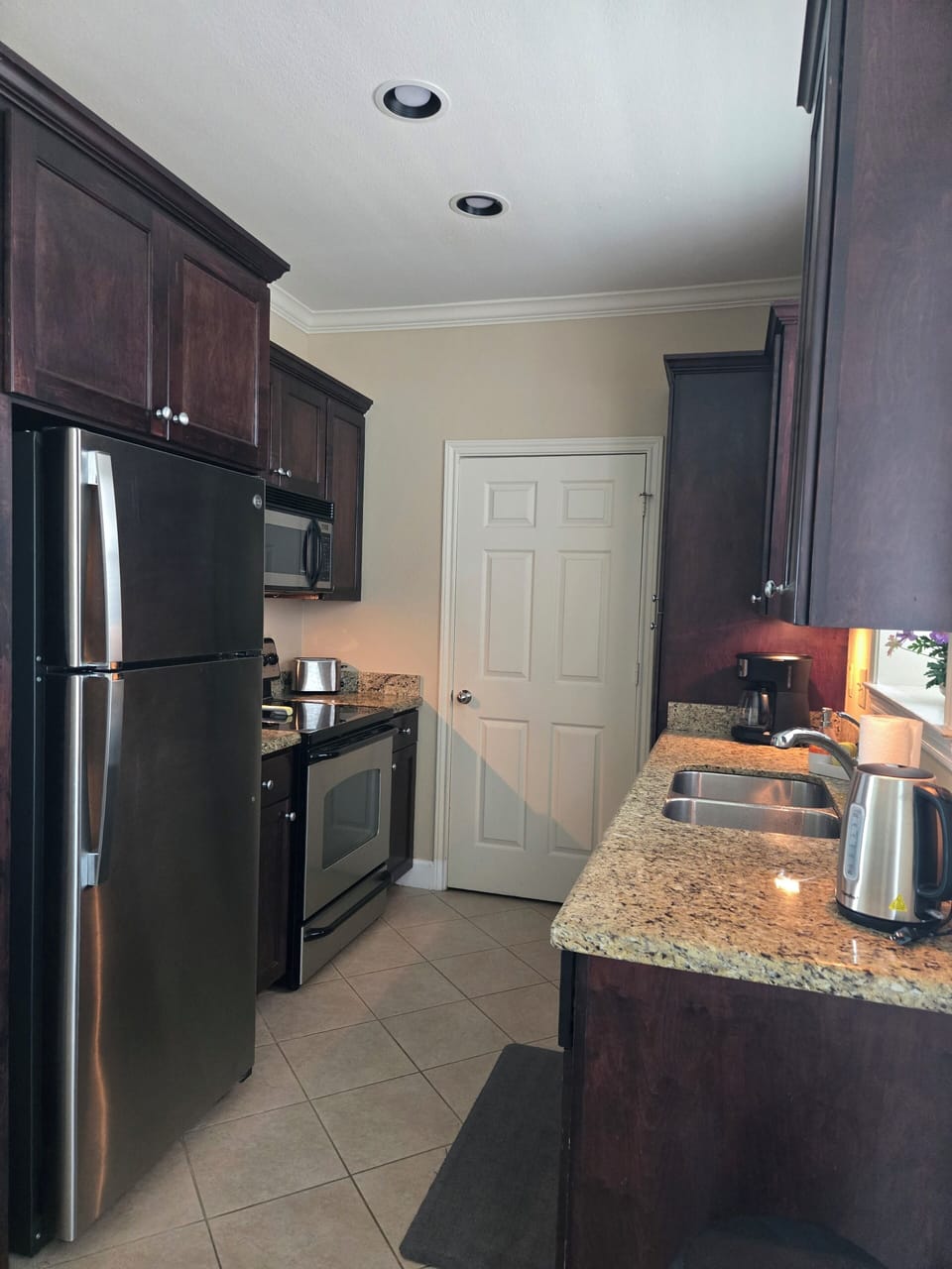 Full size kitchen with all utensils and pots and pans