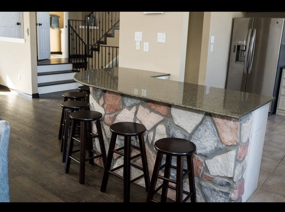 Bar off kitchen on second floor with half bath background 
