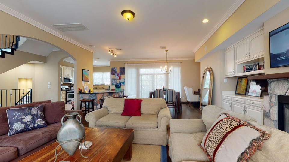 View of second floor. Living room , dining room, kitchen, bar and desk area 