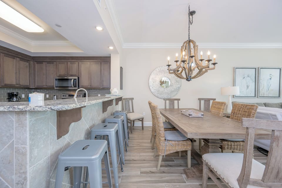Sip your morning coffee at the breakfast bar and get ready for a beach day in this stylish space