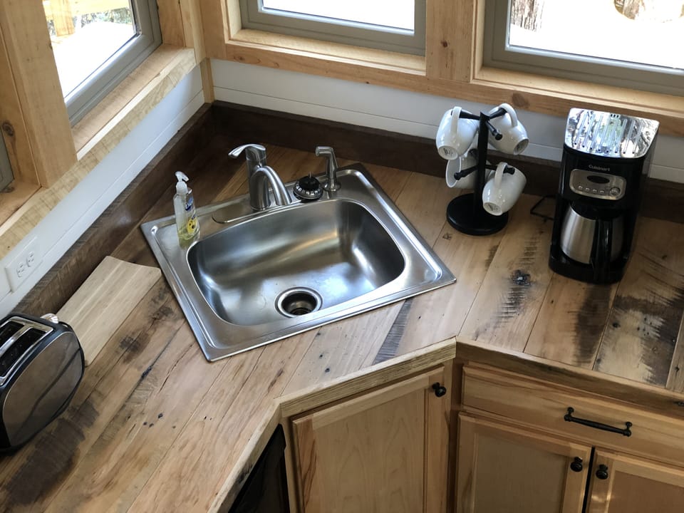 Corner sink and awesome riverwood mix  countertops.