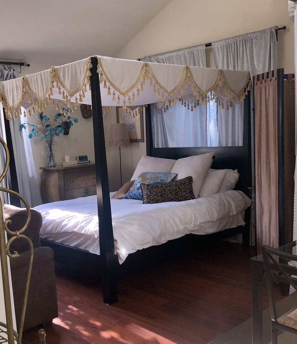 Lovely canopy bed for a romantic feel.