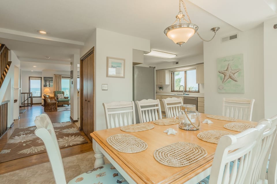 Dining area to living room and kitchen view