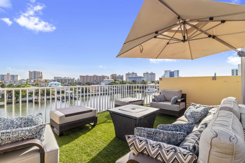 Rooftop has plenty of seating, 2 fire pits, and a large 11' cantilever umbrella