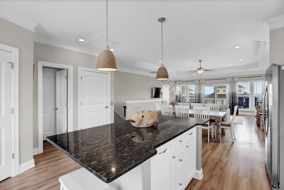 BIG ISLAND with seating for 6 (or more littles). And large pantry.