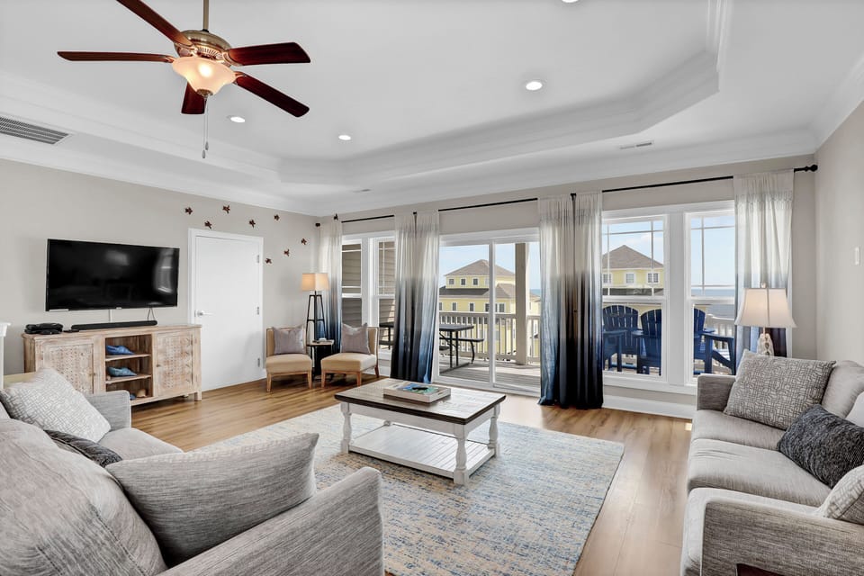 Large living space with large TV and access from OCEAN-SIDE deck