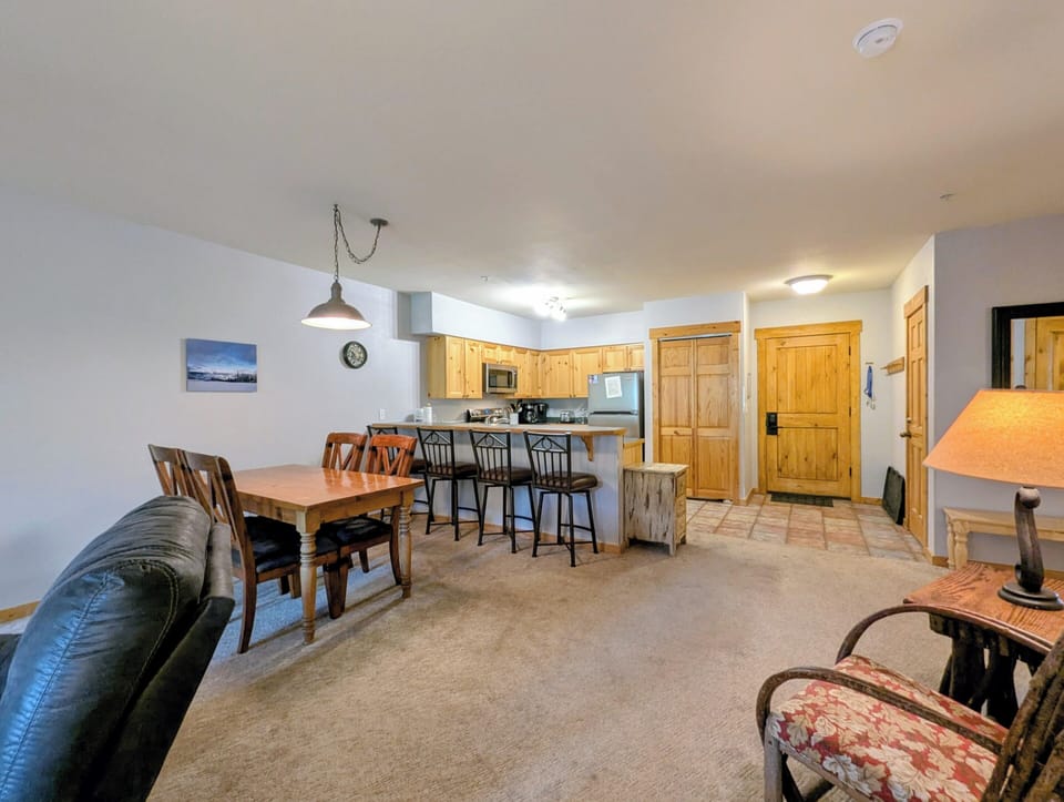 Settle into this welcoming open-concept space where warm wood accents and thoughtful layout create an inviting home base for your mountain getaway.