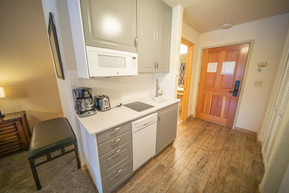 Kitchenette with a dishwasher & microwave