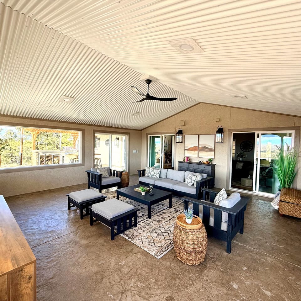Light-filled sunroom, everyone's favorite gathering spot.