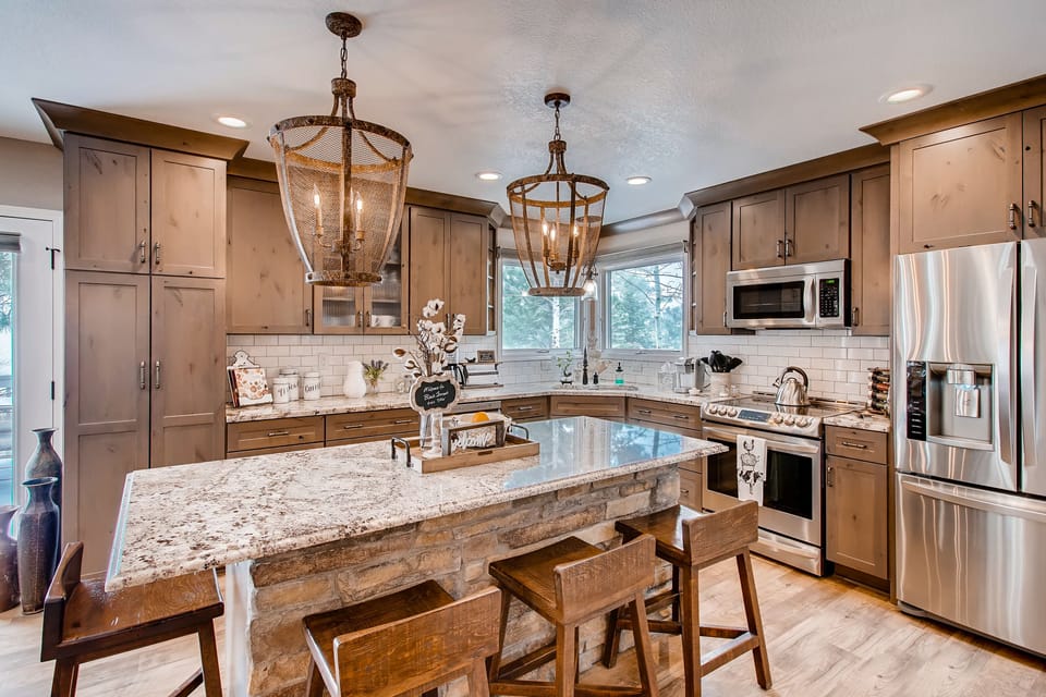 Well-equipped kitchen with granite island and plenty of prep space.