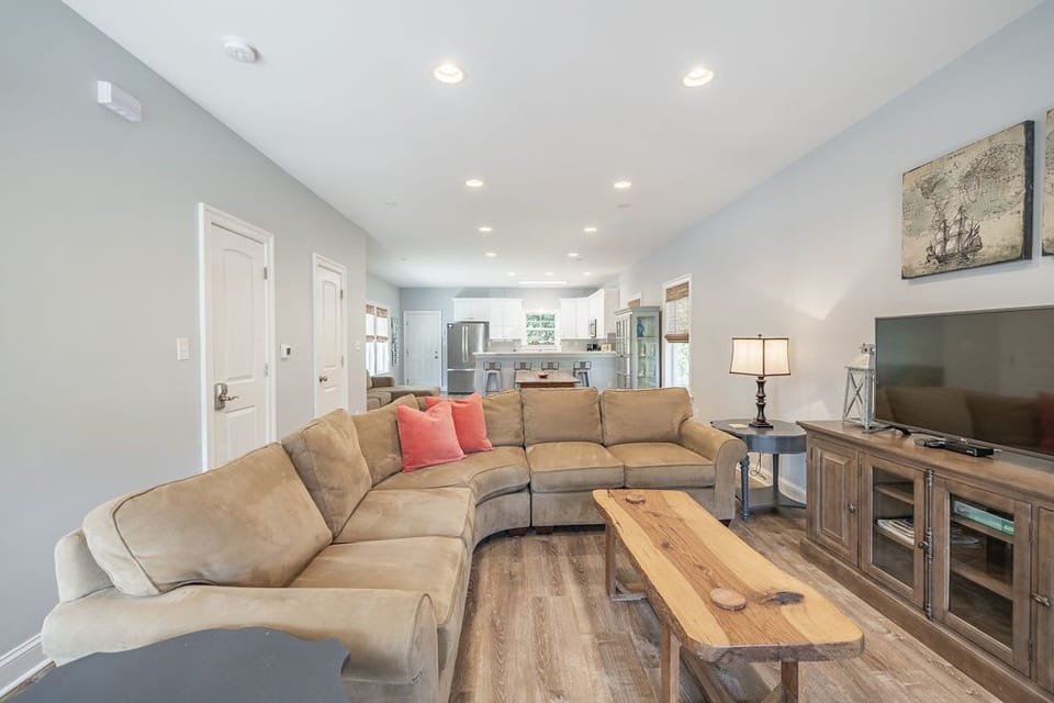 Plenty of room for the whole family on the sectional sofa with cable television.