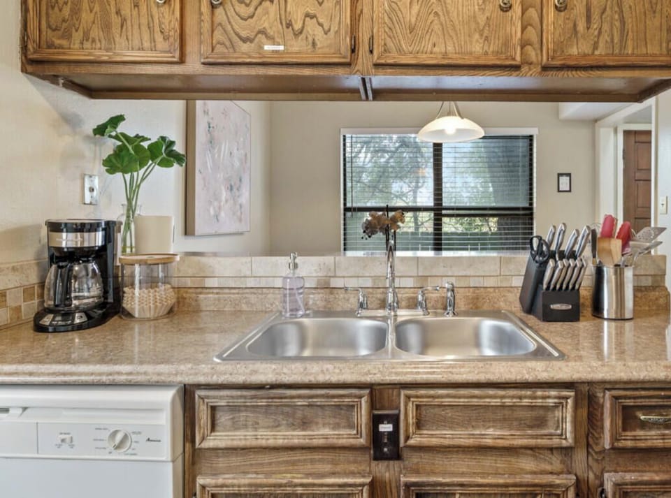 Fully equipped kitchen with all the essentials plus coffee, coffee maker, and dishwasher