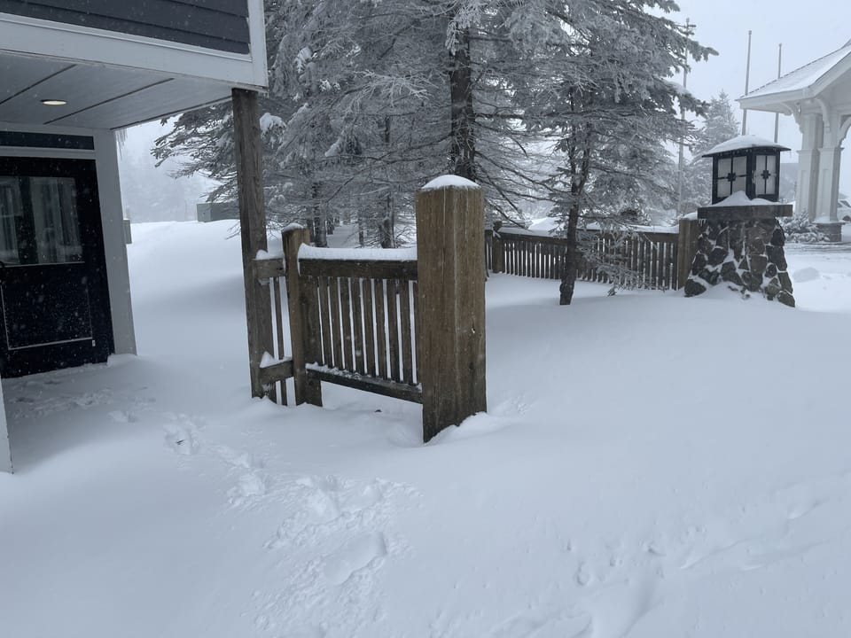 Side entrance that is steps away to the slopes or village. 
