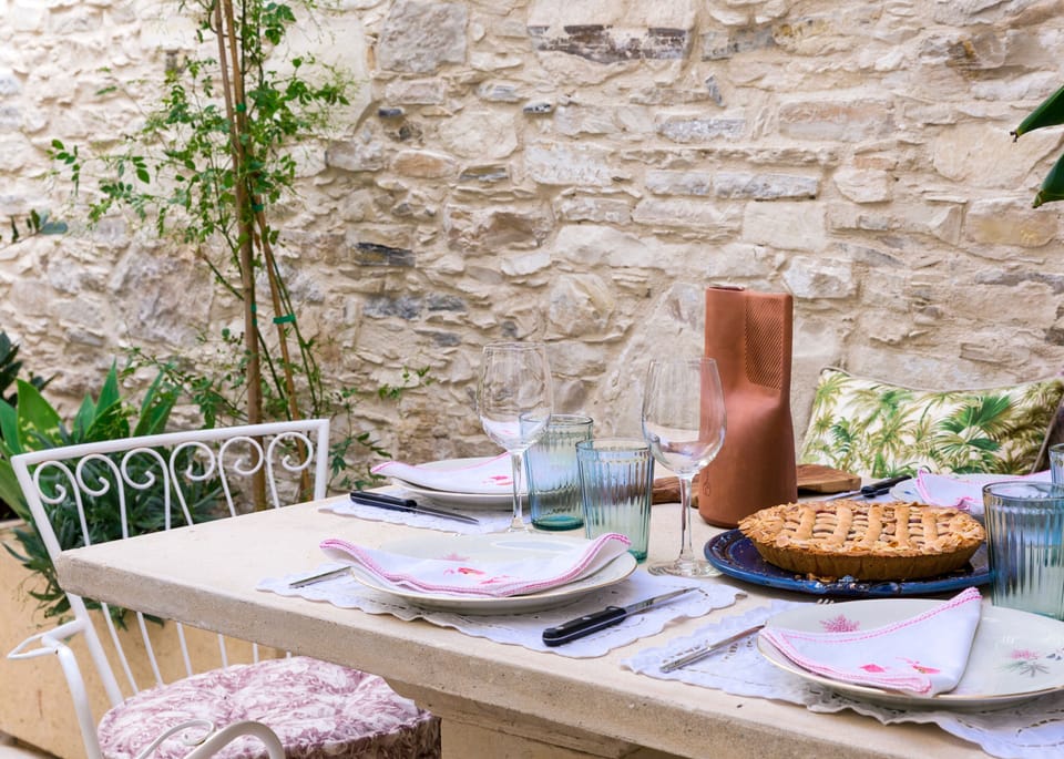 Limestone table setting in the inner courtyard under the shade
