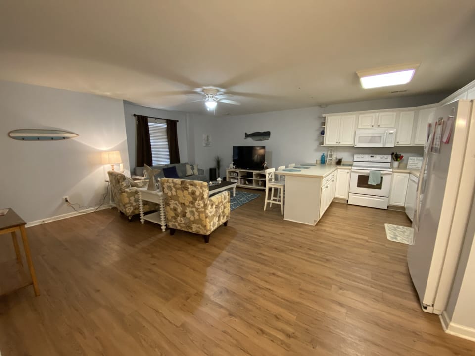 Living area and kitchen with barstools