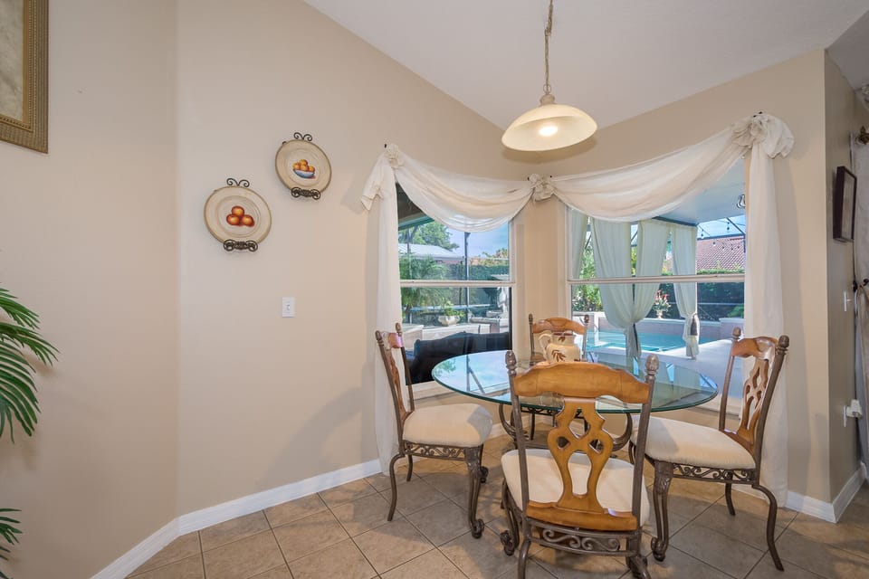 Enjoy breakfast with relaxing views of the pool.