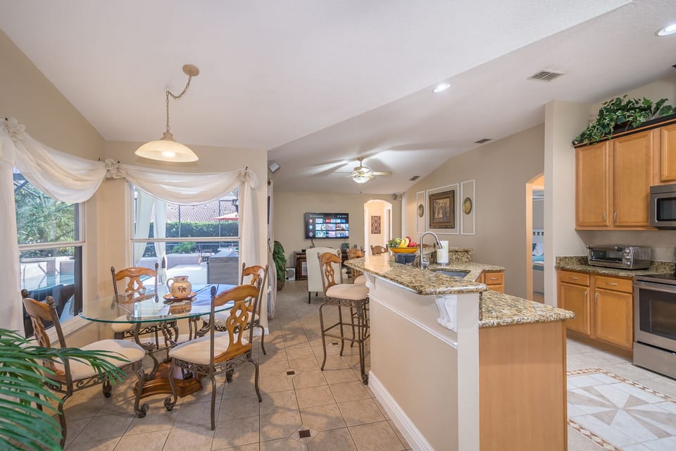 Open kitchen to TV room and breakfast nook.